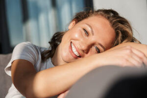 Person resting on a couch.