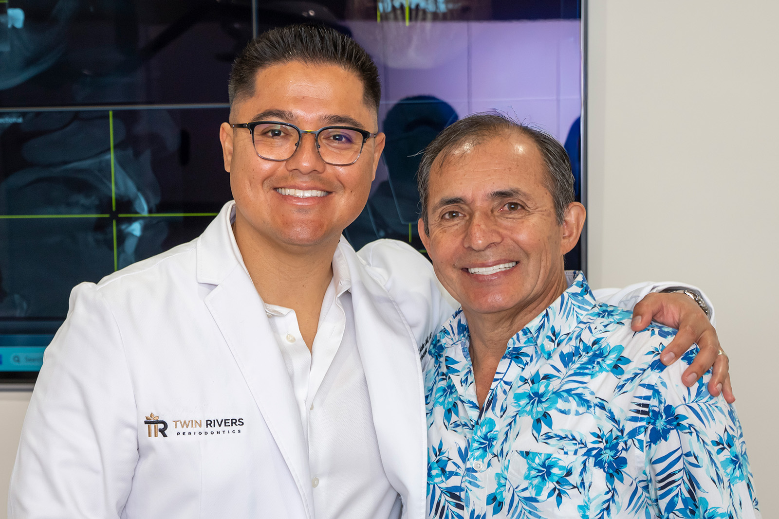 Dr. Molina smiling with a patient after a procedure